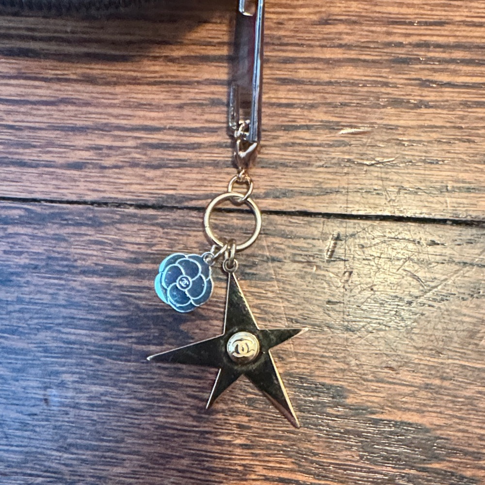 CHANEL Gold Star Keychain with Silver Flower Charm